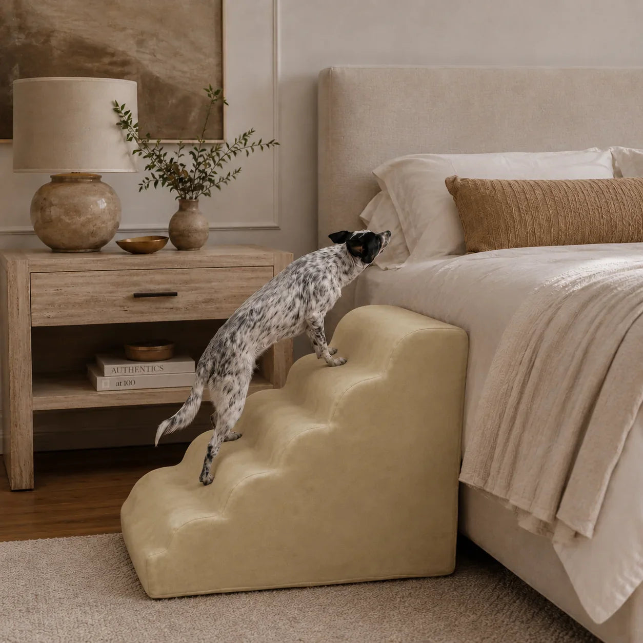 A small dog running up the Animals Matter Companion Ramp, to get up on the bed.