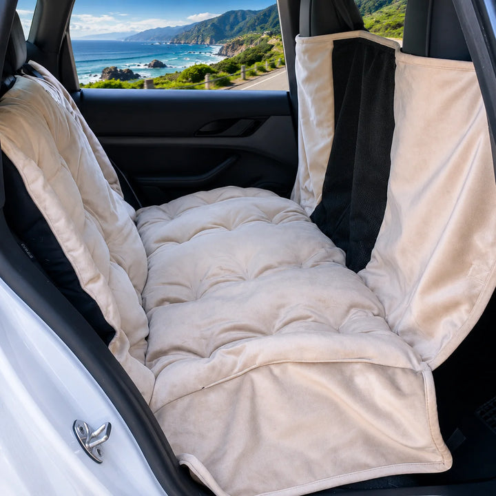 Animals Matter Companion Travel Hammock - Camel dog car hammock in a luxury vehicle, featuring a plush camel rear-seat hammock with mesh panel and coastal view.