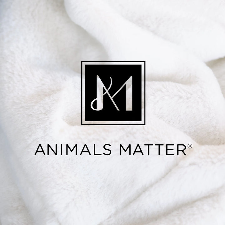 Animals Matter L.A. Dog Company Ali Blanket white cozy side fabric texture, featuring a soft plush close-up with branded logo detail.