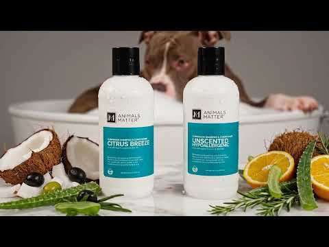 A video showcasing our shampoo with the natural ingredients surrounding it , you can see a dog getting a bath behind the scenery 