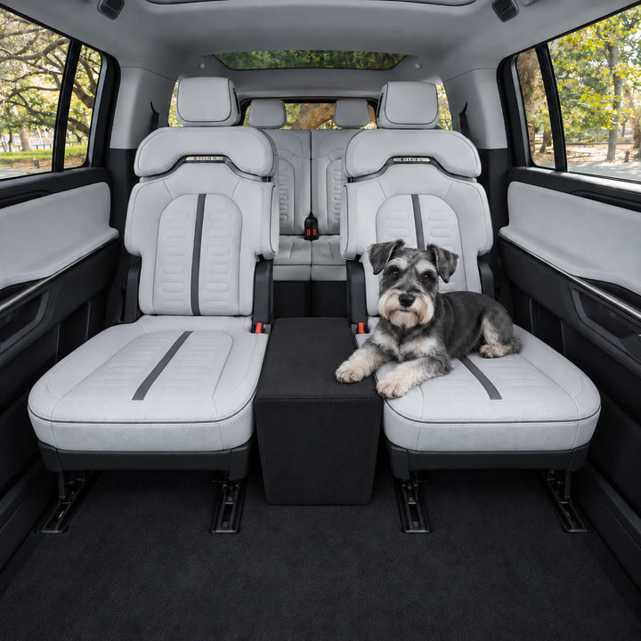 Schnauzer on a gray captain's chair with the Black XL Back Seat Extender filling the space between the two chairs